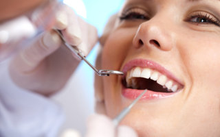 female dental patient receiving dental care